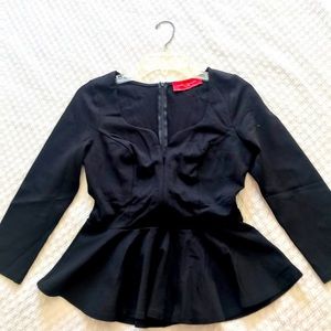 Akira brand, black long sleeve blouse. Back zipper.